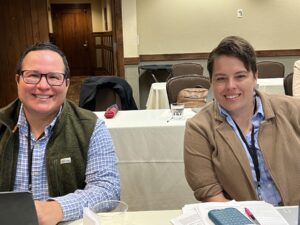 As part of the YIGWW, attendees, Sebastian Ramos, MD and Kathy Burge, MD edit grant proposals.