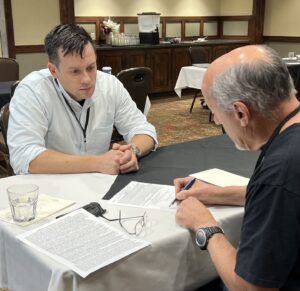 As part of the PRS Young Investigator Grant Writing Workshop, Thomas Hays, MD consults with workshop faculty member and Co-Director, Kurt Albertine, Phd.