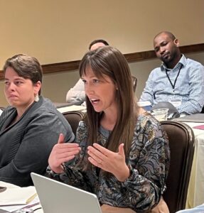 PRS Young Investigator Grant Writing Workshop attendee, Jacquelyn Lajiness questions speaker, along with Kathryn Burge, PhD and Ayodeji Sanusi, MD.