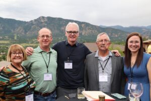 Five researchers attend a reception at an annual scientific meeting.