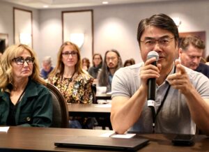 Audience member questions the speaker at the PRS 2025 Annual Meeting.
