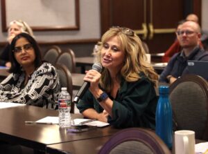 Audience member questions a speaker at a national scientific meeting.