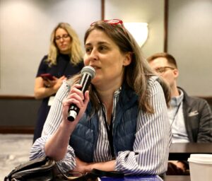Attendee questions a speaker at the national meeting of a scientific research society.