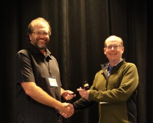 The presidential gavel is handed off from the PRS 2025 president to the 2026 president.