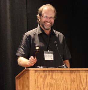 PRS 2025 Paul Rozance uses the gavel to open the meeting.