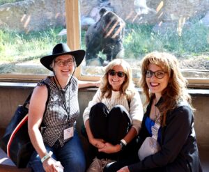 Three participants at an annual perinatal research meeting visit the Cheyenne Mountain Zoo as part of the meeting.