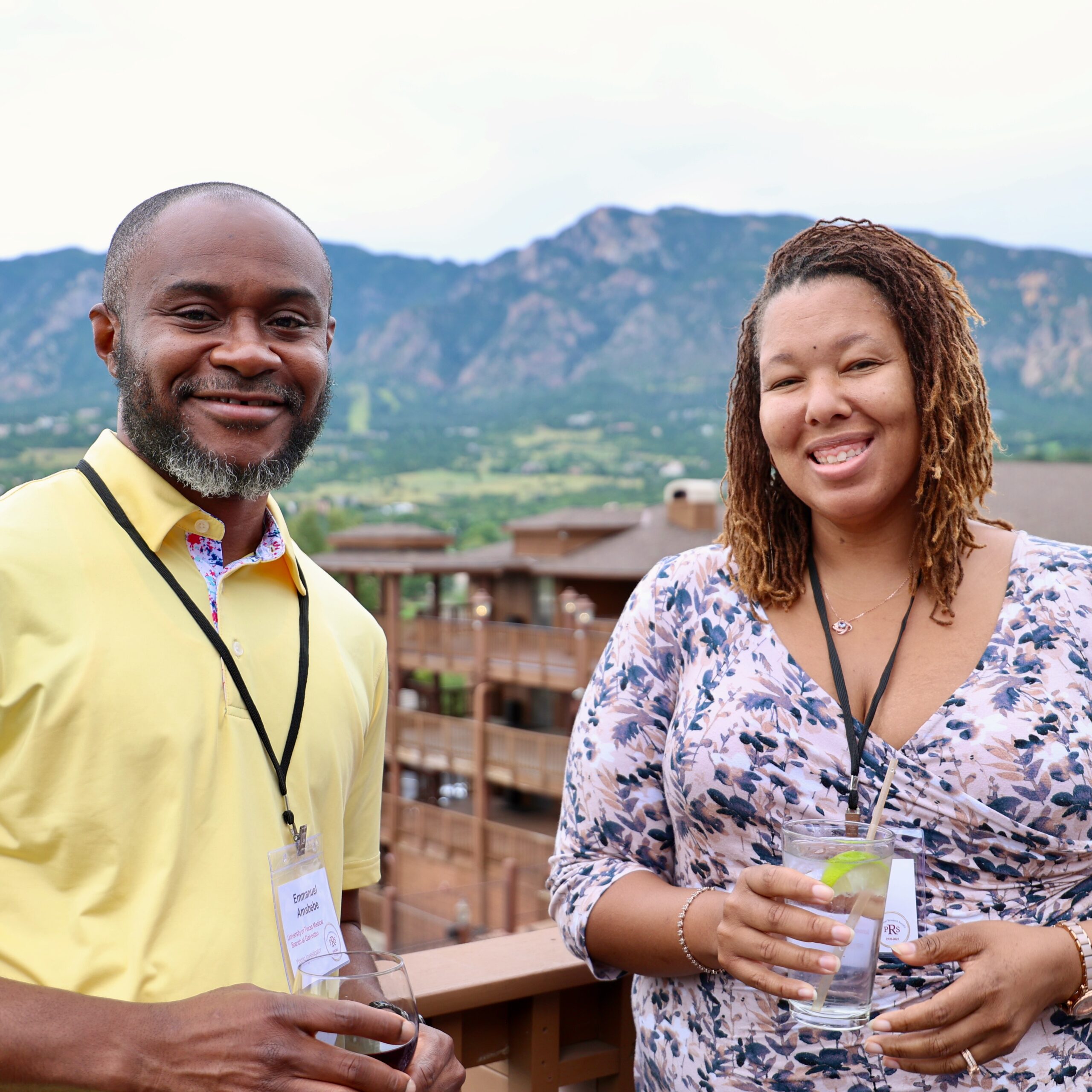 members mingling after meeting with mountains in the background