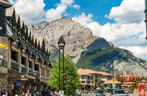downtown view of shops with mountains in the background Banff, Alberta, Canada