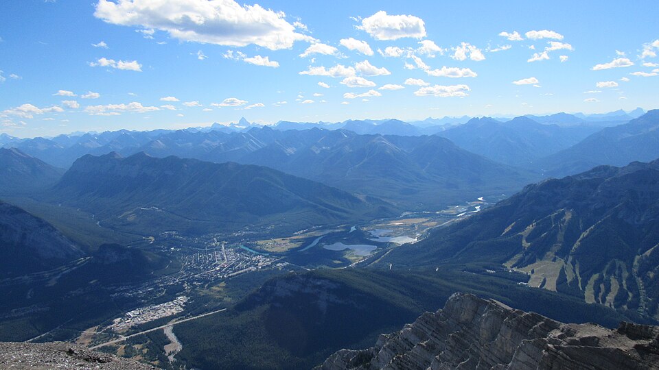 clouds mountains and scenic view of the city and landscape