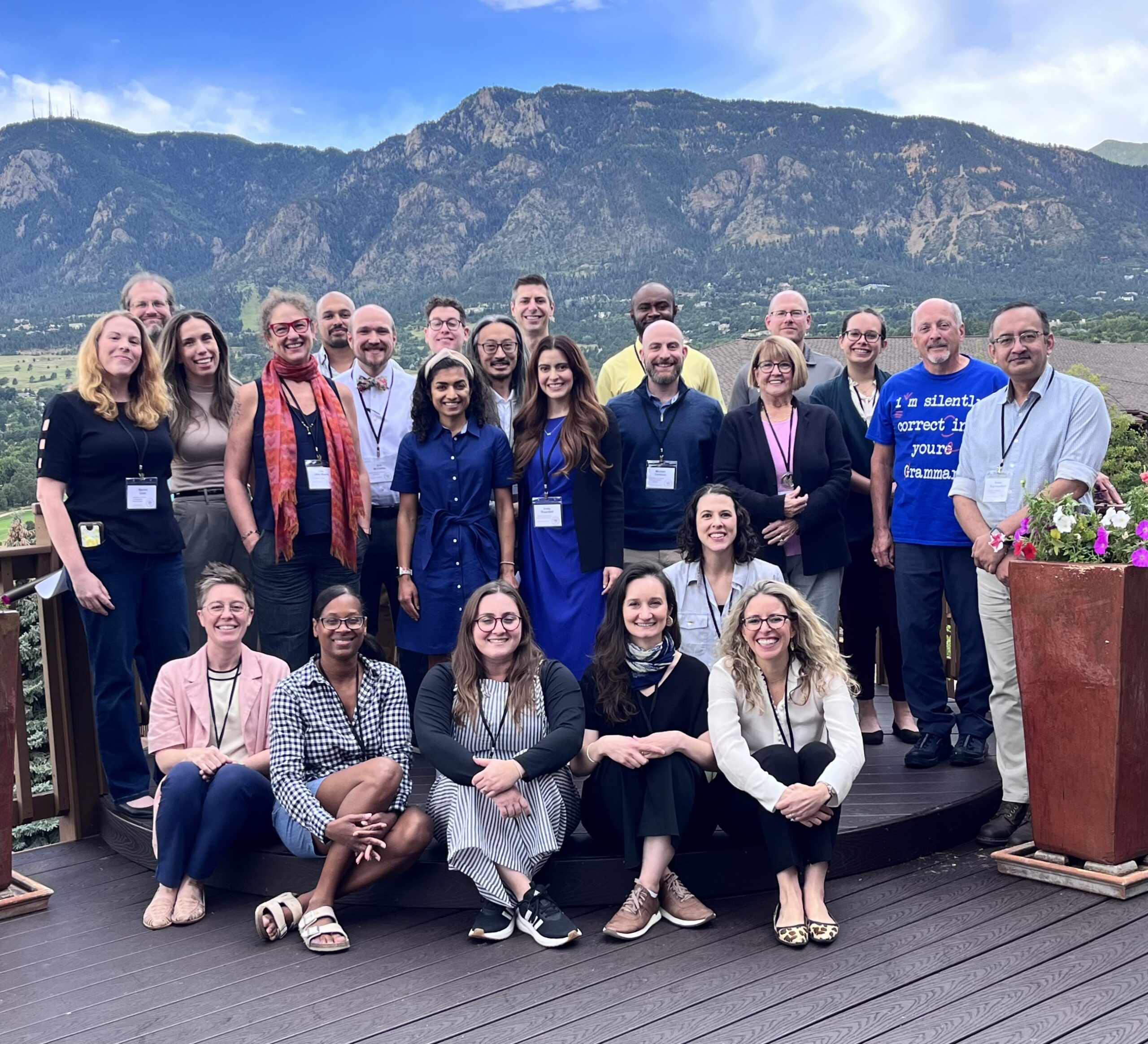 PRS leadership and workshop participants pose with Rocky Mountain landscape in the back