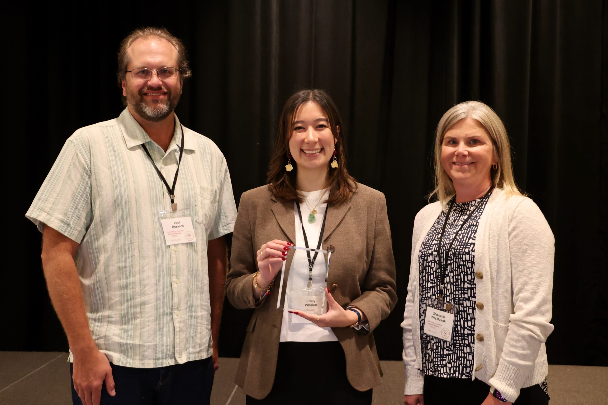 Emily Whalen, MD-PhD Candidate, (center) receives the 2025 PRS-PSANZ Mont Liggins Early Career Award from Paul Rozance, MD, 2025 PRS President (left) and Stephanie Wesolowski, PhD, 2025 PRS Secretary-Treasurer. 